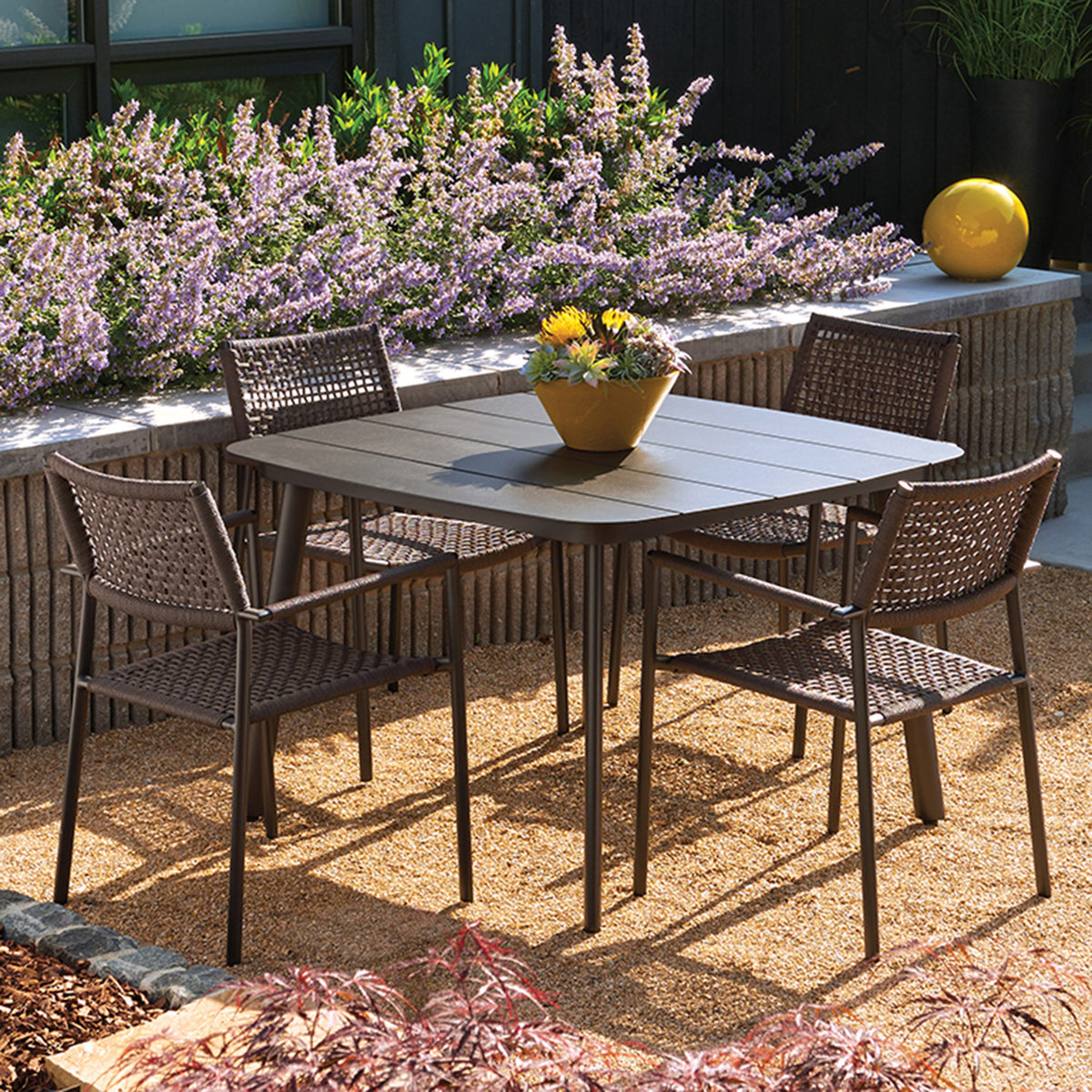 Oxford Garden Eiland 5-Piece Square 45 inch Dining Set shown set up in an outdoor setting
