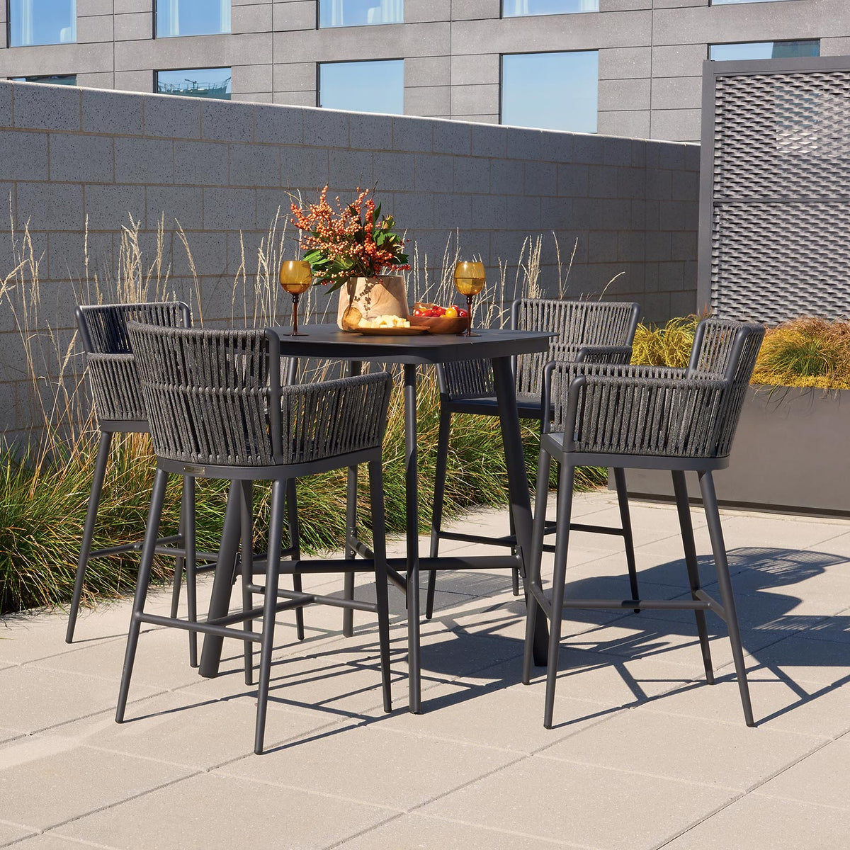 Oxford Garden Nette 5-Piece Square 36 inch Bar Set shown set up in an outdoor setting