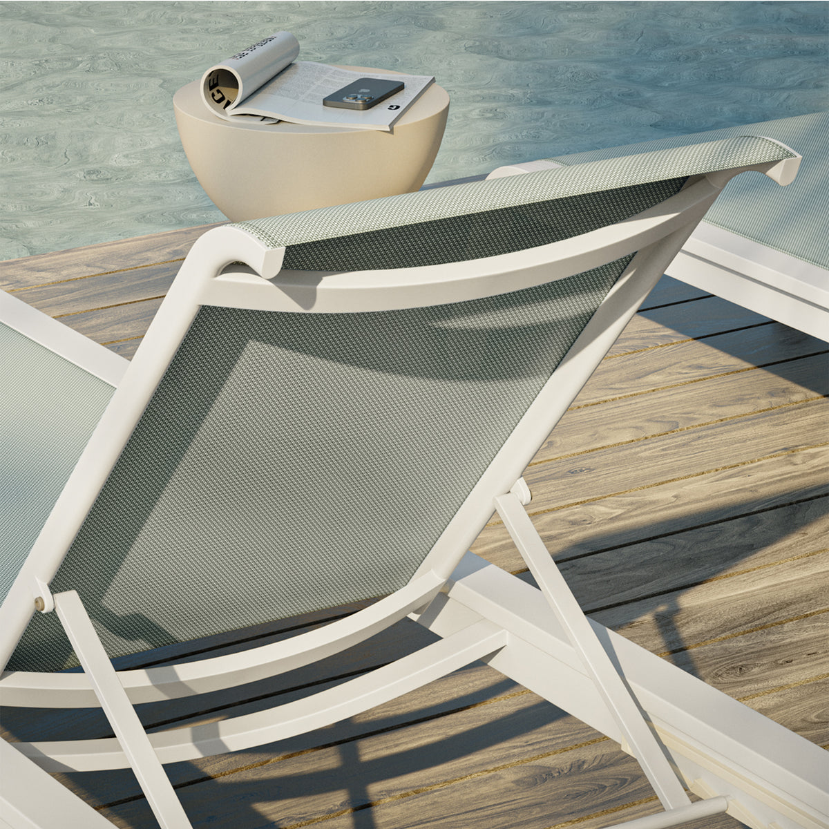 Detail of the padded sling and aluminum frame on the Agen chaise lounge