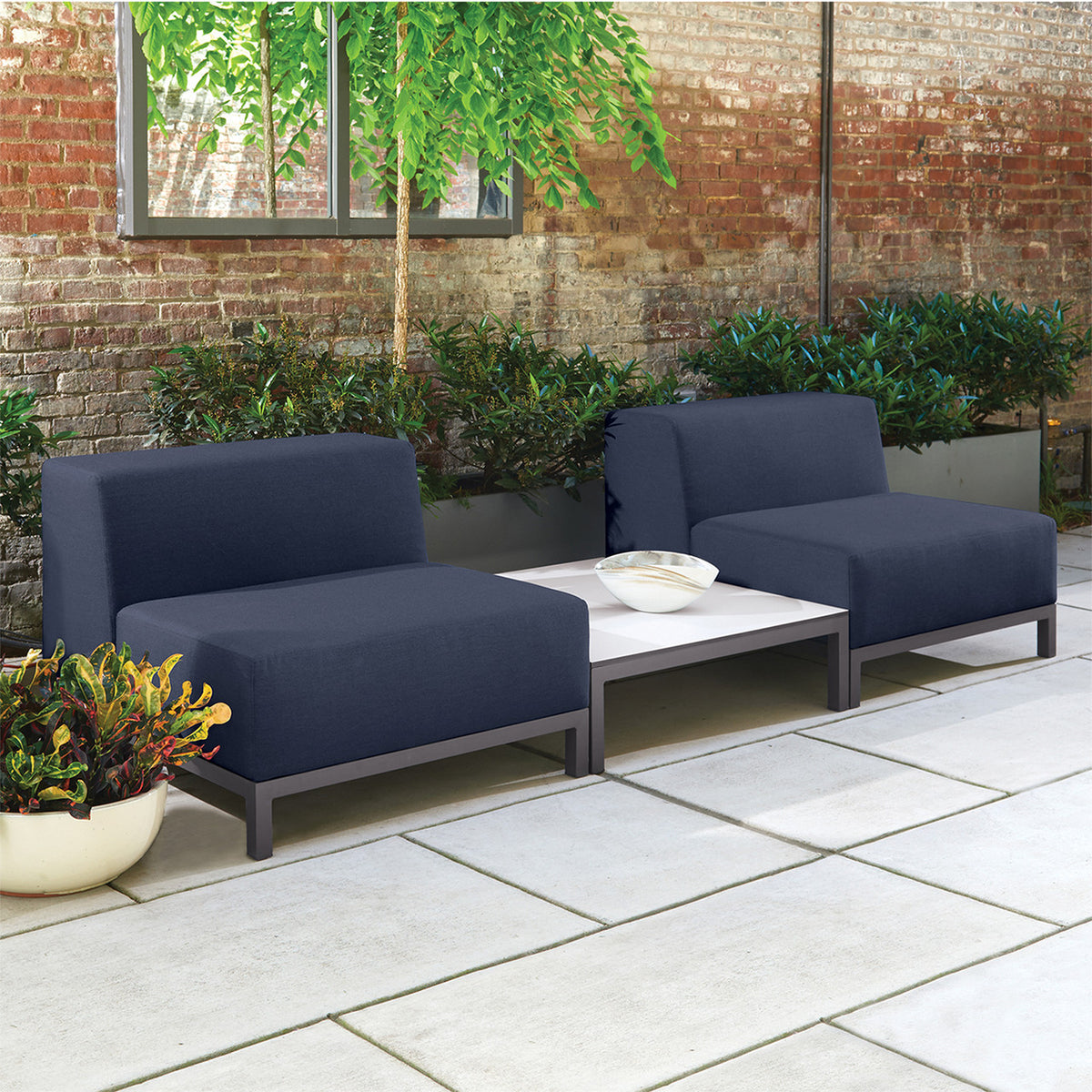 Oxford Garden Koral Modular Side Seat Upholstery shown in an outdoor setting