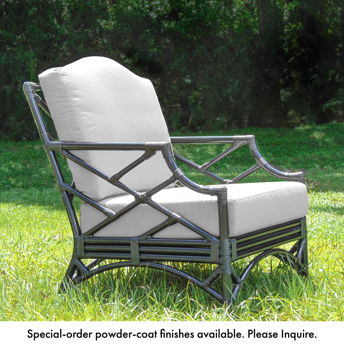 Chippendale outdoor lounge chair in a black frame with white cushions