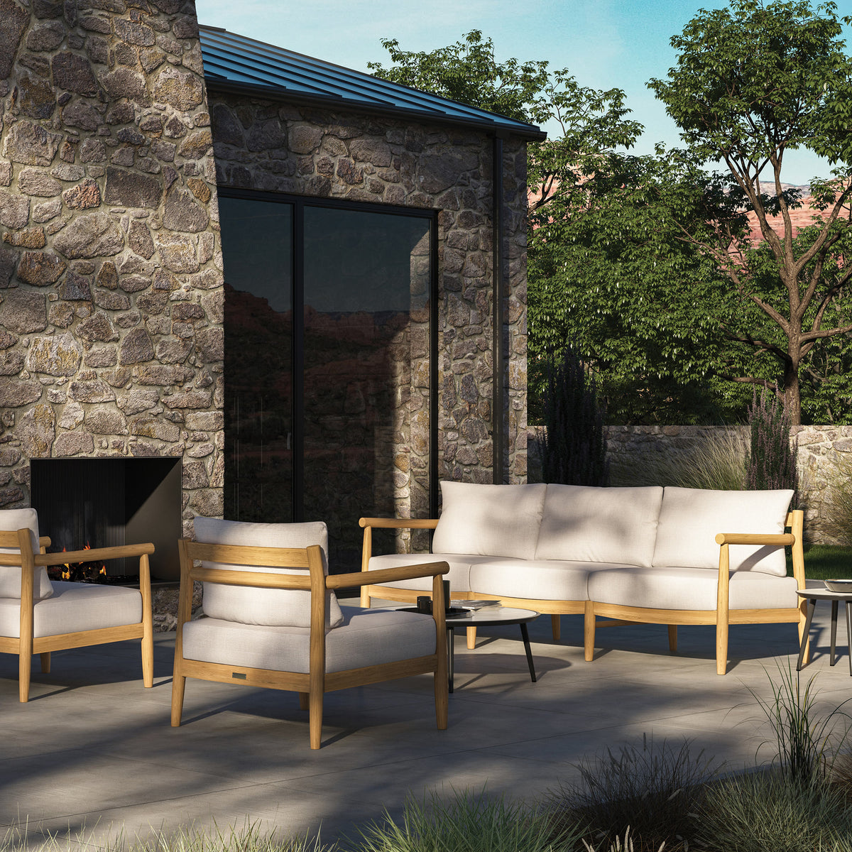 Lido three seat teak sofa styled outdoors with deep quick-dry seat and back cushions