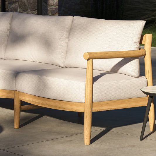 Close view of Lido teak lounge seating with deep seat and back cushions in place
