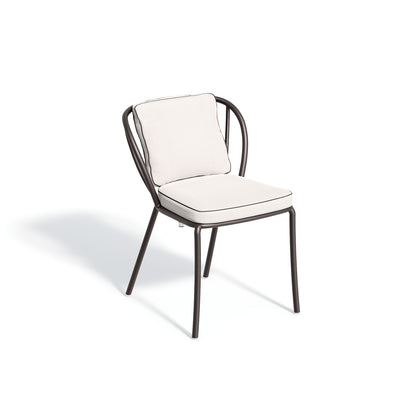 Malti side chair dressed in a Bliss Linen seat and back pad, photographed against white