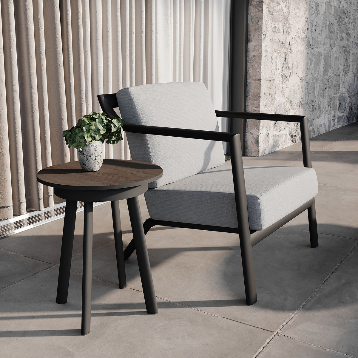 Oxford Garden Markoe Club Chair shown in an outdoor setting