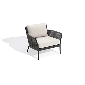 Nette club chair with Bliss Linen seat and back cushions on a carbon frame, against white