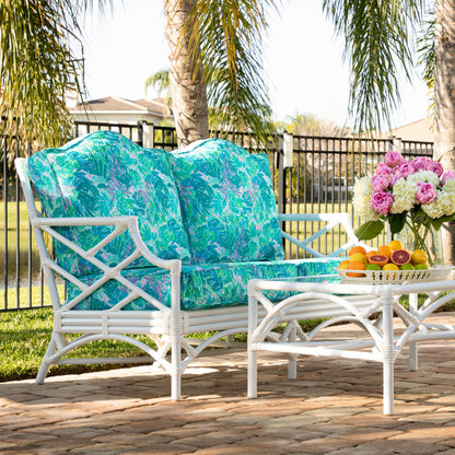 Chippendale outdoor seating and the matching coffee table styled beside a pool