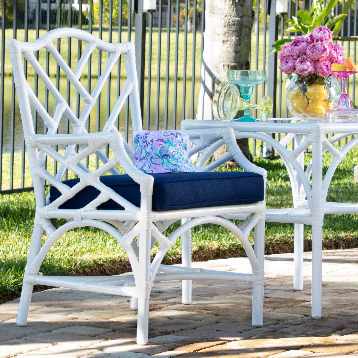 Chippendale outdoor dining armchair in a poolside setting