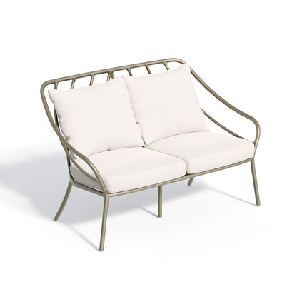 Seavo loveseat dressed in Bliss Linen cushions on a satin powder coated frame, on white
