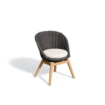 Tulle dining armchair in the Shadow weave with a Bliss Linen seat pad, on white