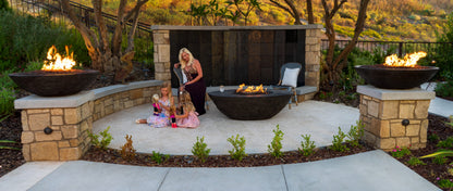American Fyre Design Calais Oval Fire Table, a chat height oval gas fire table, in an outdoor setting
