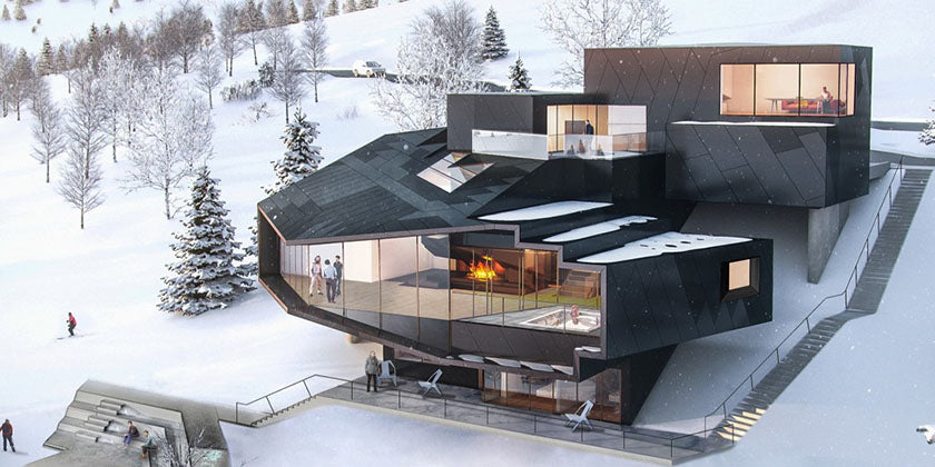 Modern mountain home with a fireplace glowing through the glass