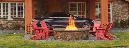 FireGarden Voracious Fire burner lit in a finished outdoor fire pit