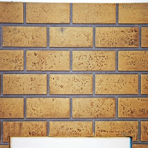 Napoleon GDS819KT sandstone decorative brick panels with a staggered masonry pattern for gas fireplace interiors.