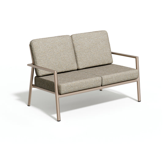 Oxford Garden Eiland 52 inch deep seating outdoor loveseat with Sunbrella cushions on a taupe powder coated aluminum frame, shown on a plain white background