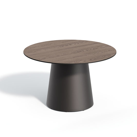 48 inch round outdoor dining table with a Marshland Oak laminate top on a dark pedestal base