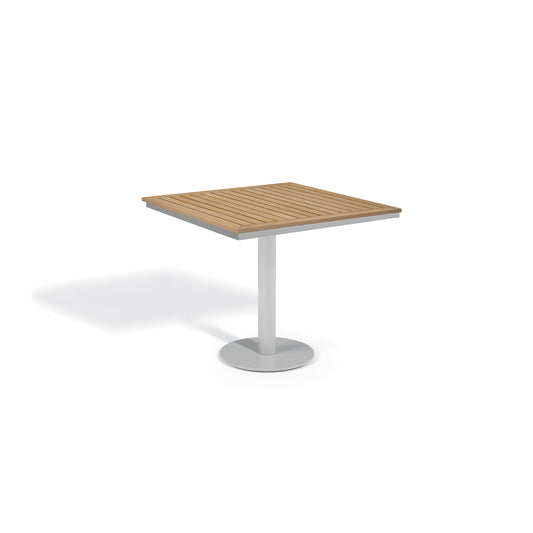 Square outdoor pedestal table with a slatted Natural Tekwood top on a wide Flint gray base