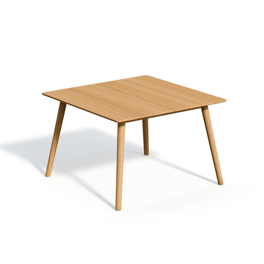 Square solid teak dining table with a center umbrella hole, on a plain white background