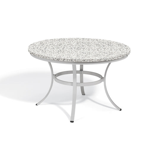 Oxford Garden Travira 48 inch round outdoor dining table with an Ash Lite-Core top on a flint grey powder coated aluminum frame, shown on a plain white background