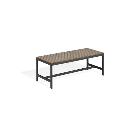 Oxford Garden Travira four foot backless outdoor bench with a slatted seat on a carbon black powder coated aluminum frame, shown on a plain white background