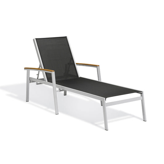 Oxford Garden Travira outdoor chaise lounge with a tensioned sling deck on a flint grey powder coated aluminum frame, shown on a plain white background