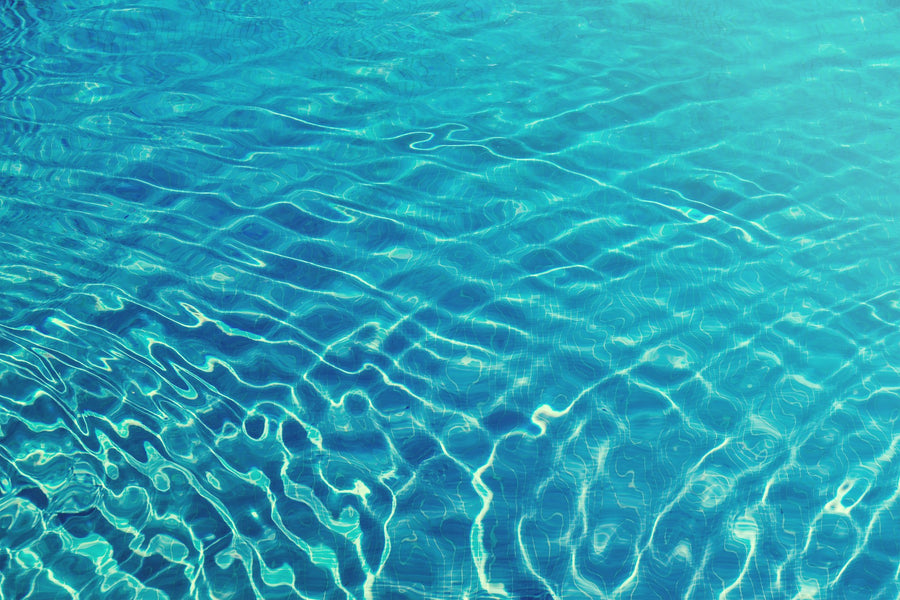 Sunlight on rippling pool water