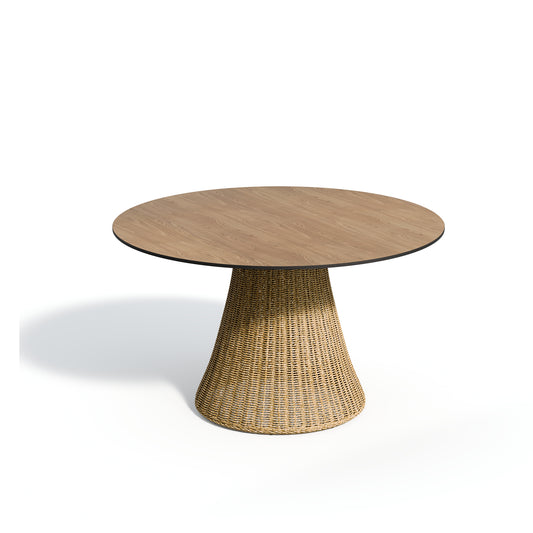 Round laminate topped dining table in the Enigma decor on a pale woven pedestal base